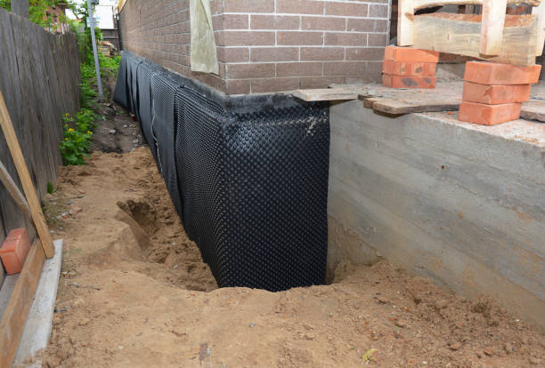 Happy homeowners after waterproofing job in Watchung